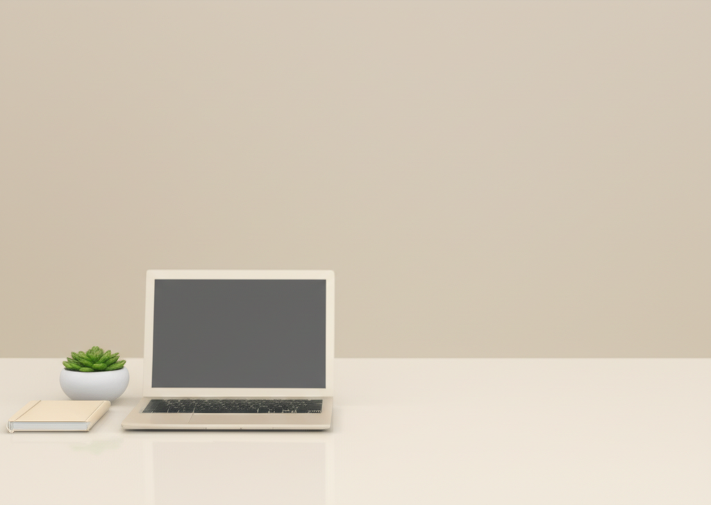 A single, uncluttered desk with a minimalist laptop, a small potted plant, and a notebook.  The background is a plain, calming color (like a soft grey or beige).  The overall feeling is one of peace and serenity.
